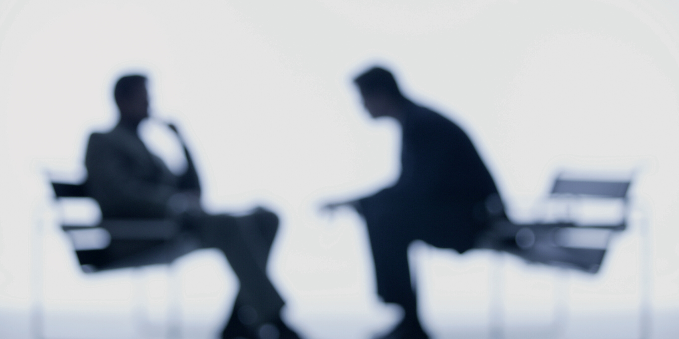 shadows of two people talking