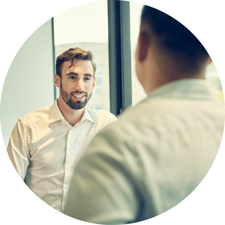 Two men talking in an office