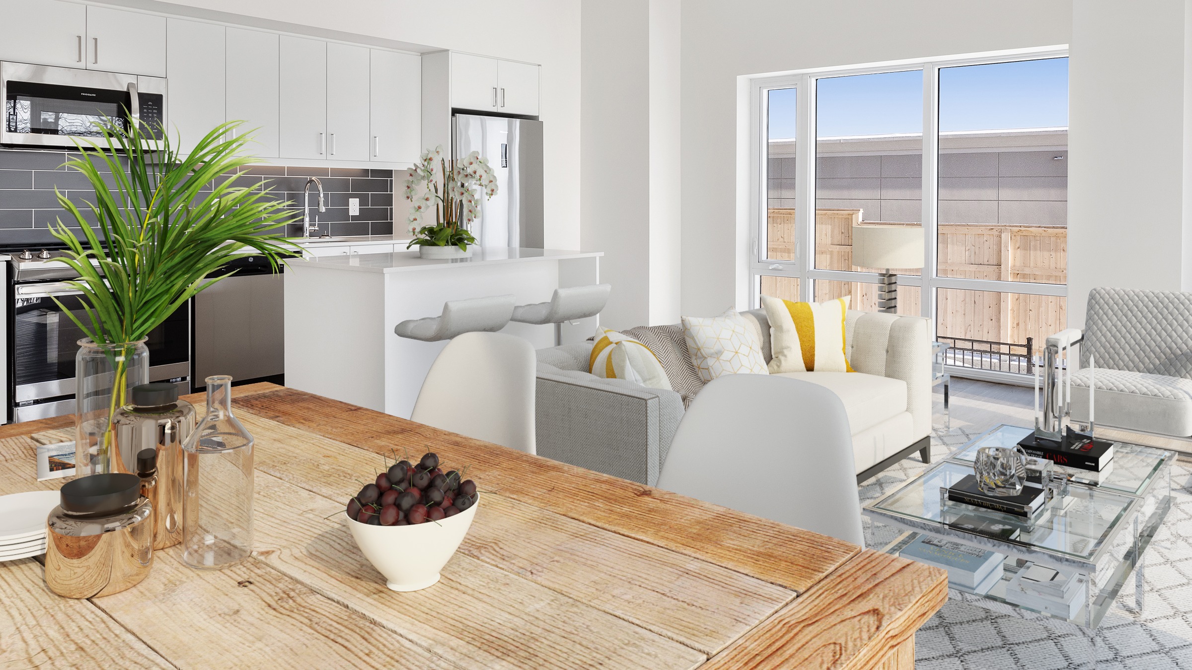 Kitchen and living space with windows, couch and built in cabinetry.